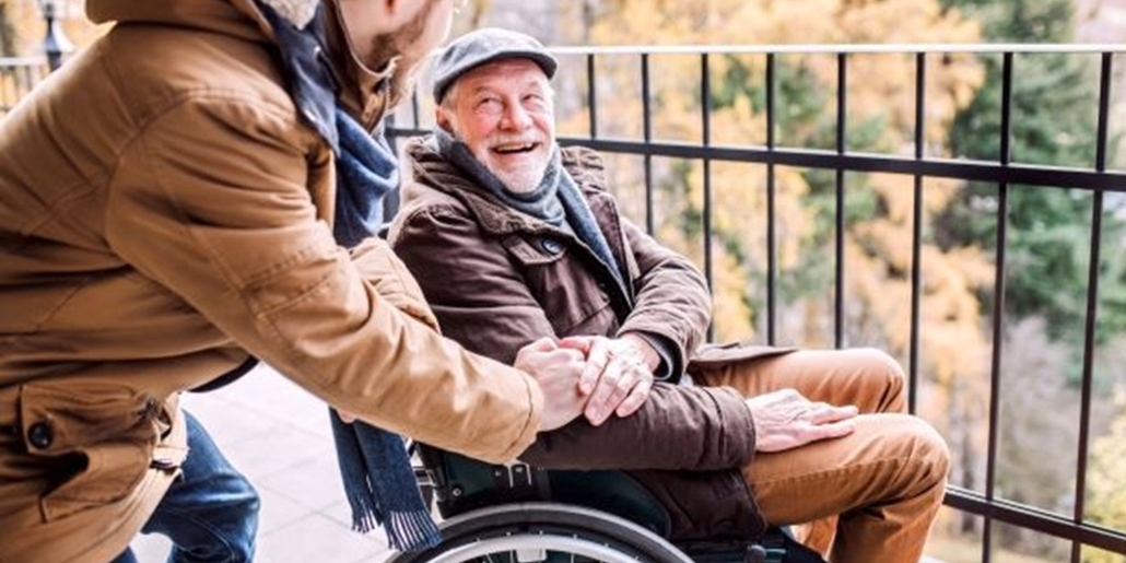 Man in wheelchair smiling 